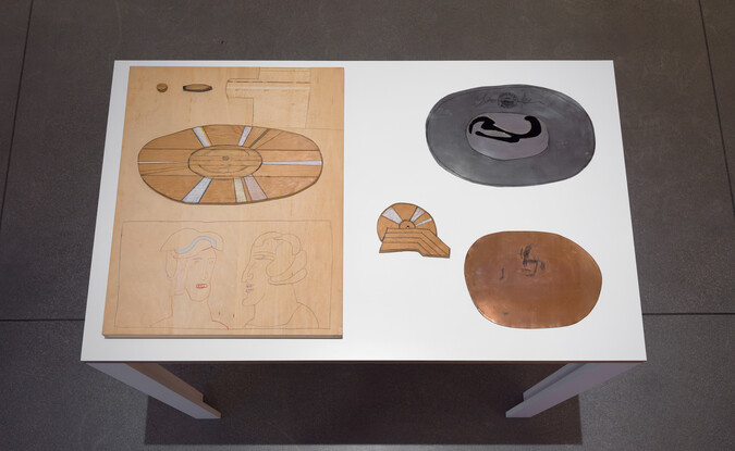 medium close-up shot of a table with three-dimensional artworks
