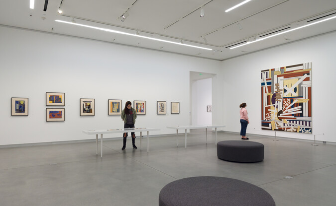 wide shot of two visitors in gallery