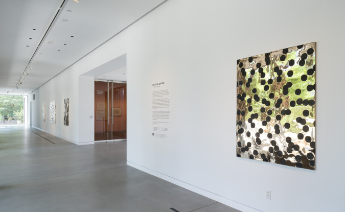 wide shot of art hall with bronze relief hung on the wall