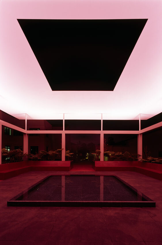 Nighttime view of the James Turrell Skyspace with pink lighting
