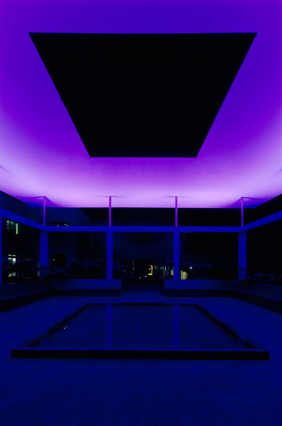 Nighttime view of the James Turrell Skyspace with purple lighting