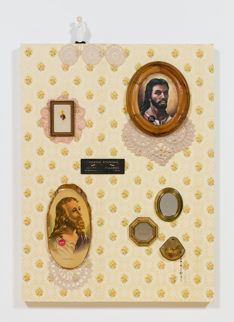 canvas covered in beige patterned fabric. with various collaged items including two images of jesus