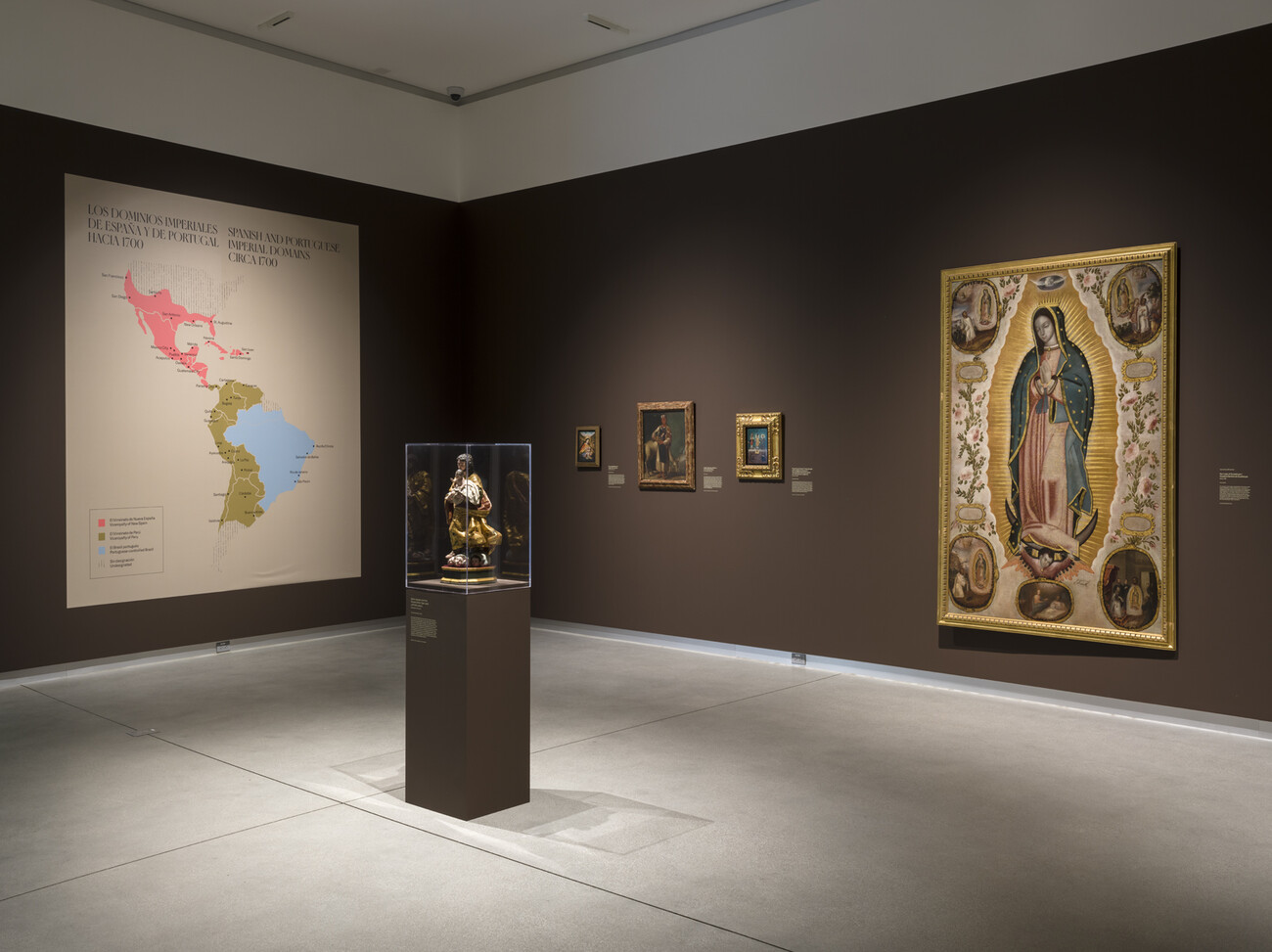 brown gallery with map and large paintings