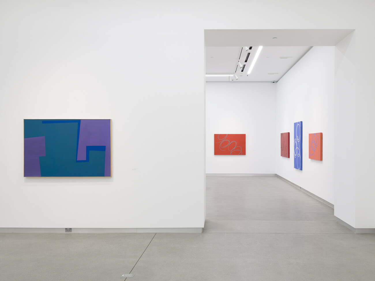 galleries with blue and red paintings