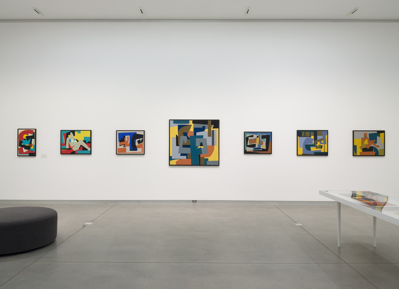wide shot of abstract artworks on wall