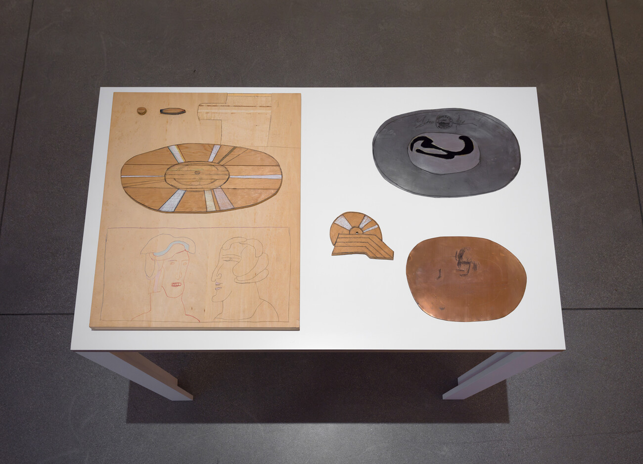 medium close-up shot of a table with three-dimensional artworks