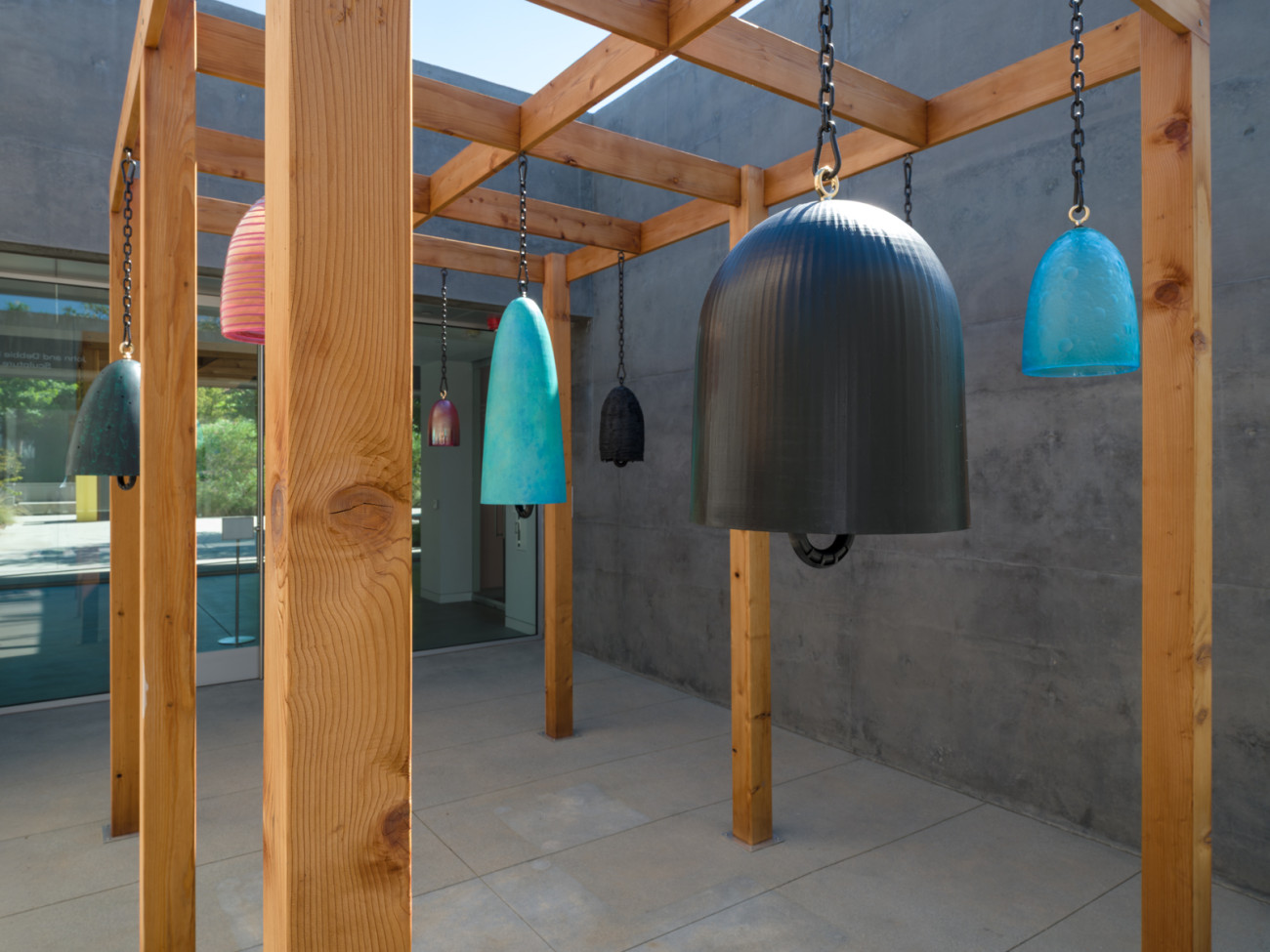 medium shot of bronze bell in foreground and other bells in background