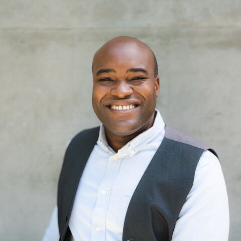 man wearing vest and button down