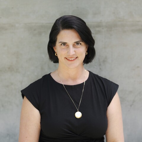 Woman wearing black and necklace