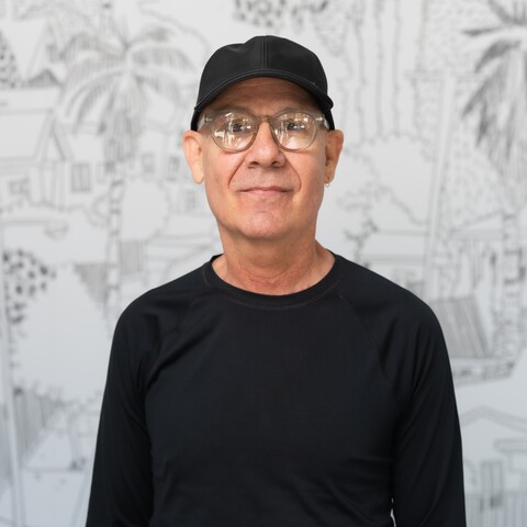 man in glasses and black cap