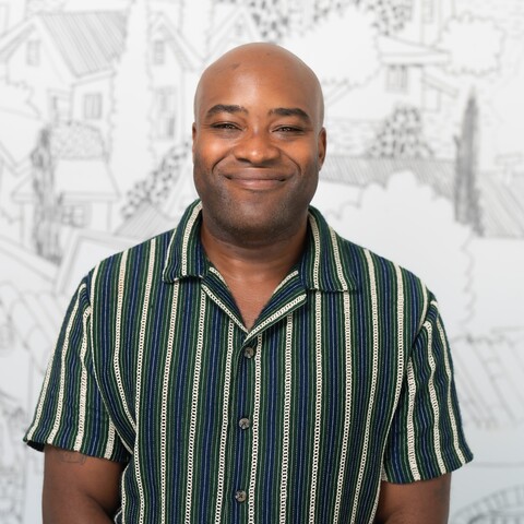 man smiles at camera