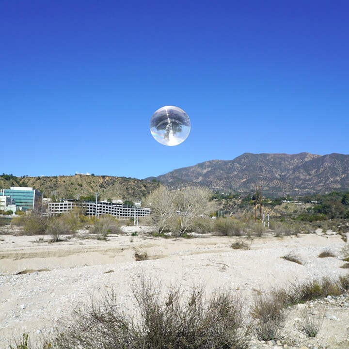 sphere over desert landscape