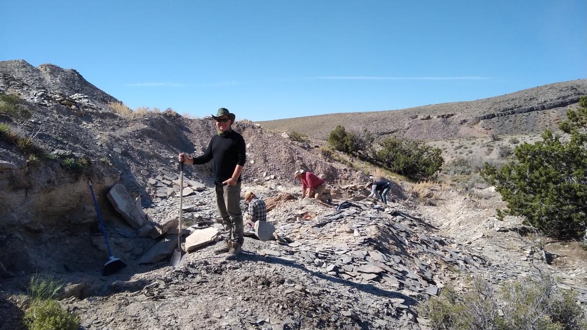 Bob Gaines stands in a field of dirt and rocks