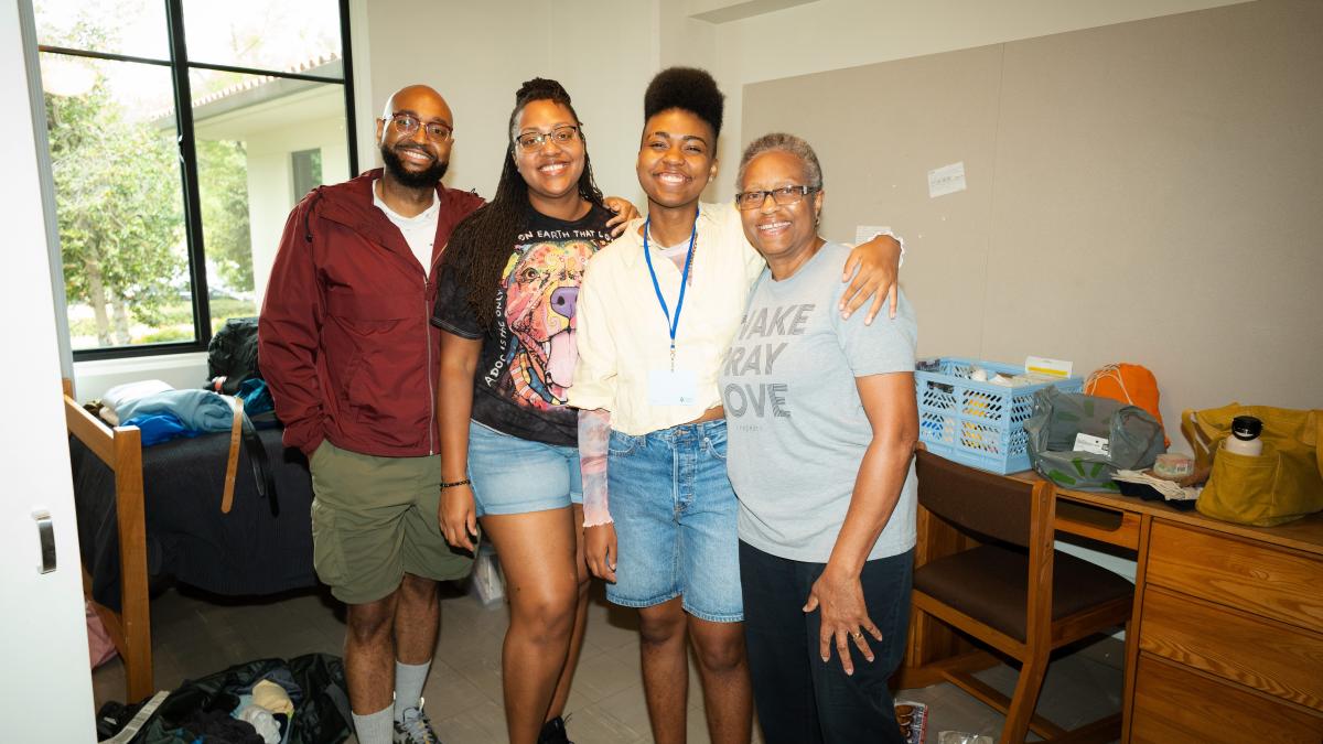 A family inside a dorm room