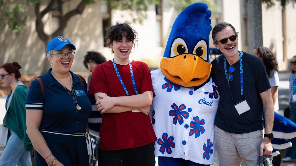 Gabi Starr and Cecil take picture with family