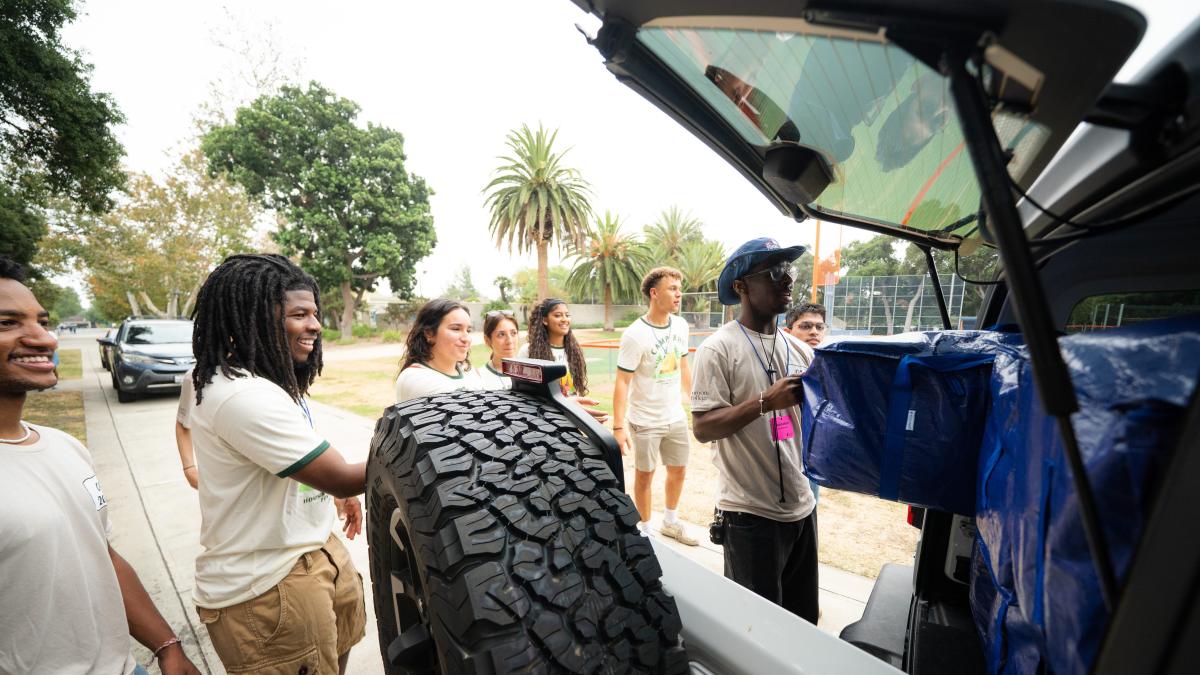 Students help offload cars