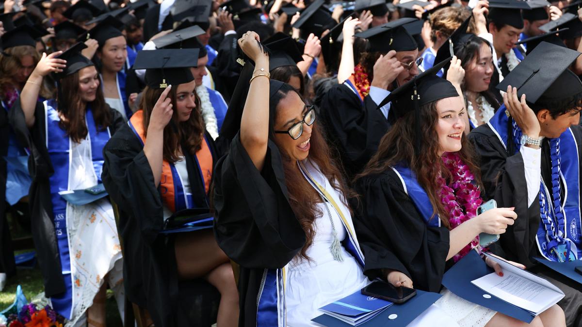 Class of 2025 members move their tassels over during Commencement exercises.