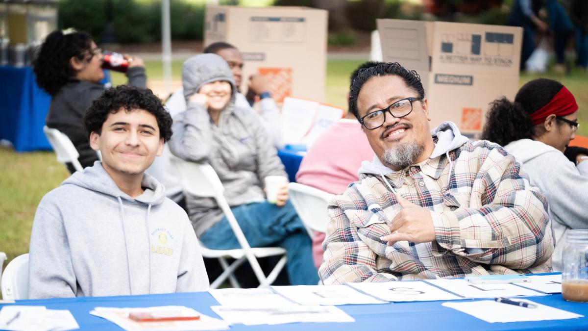Sefa Aina and a student