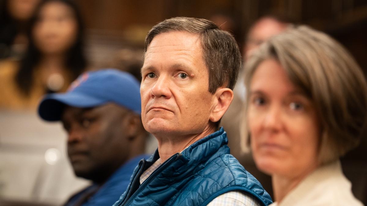 Man listens to a speech