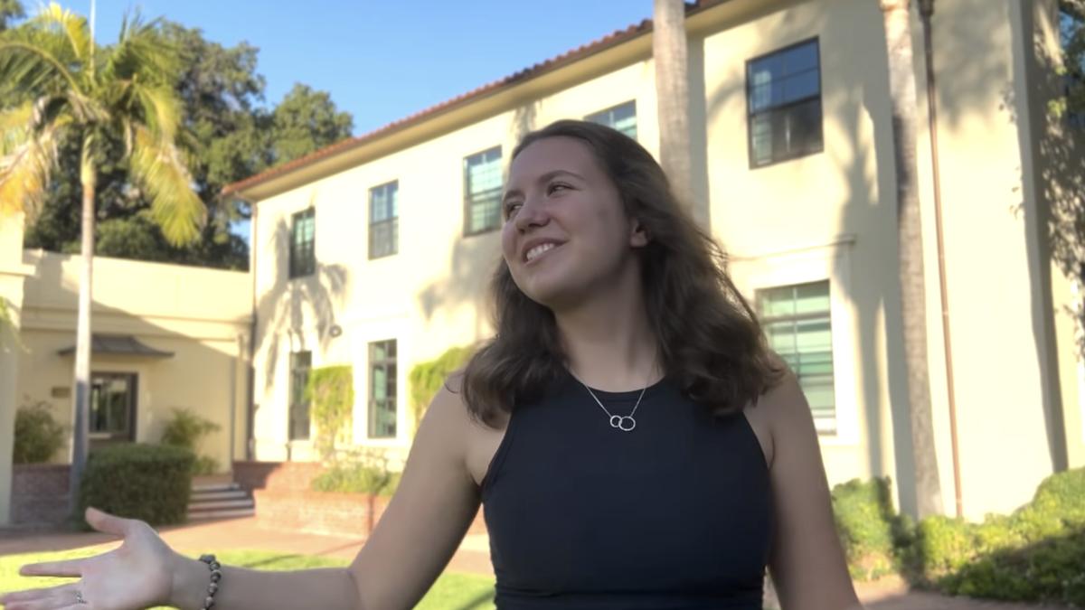 Student stands in Mudd-Blaisdell hall courtyard