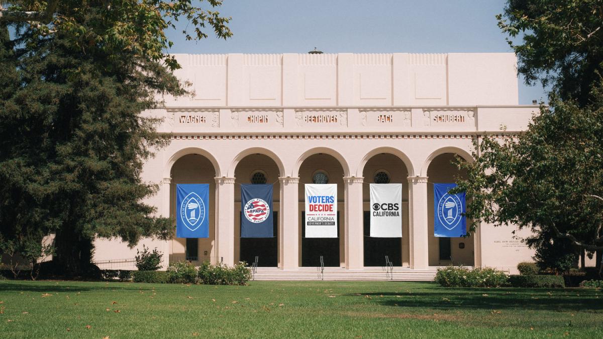 Bridges Auditorium with Pomona College, APAPA, Voters Decide, and CBS California banners