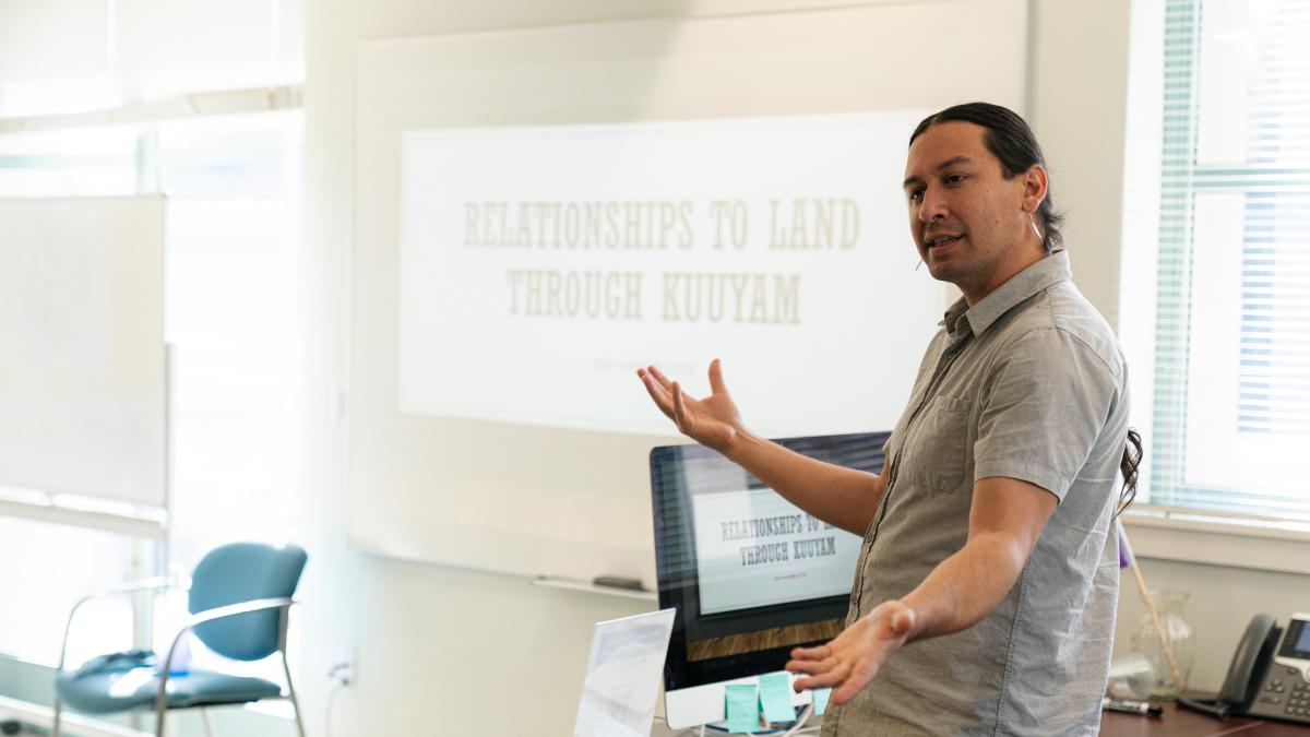 An administrator talks to a class