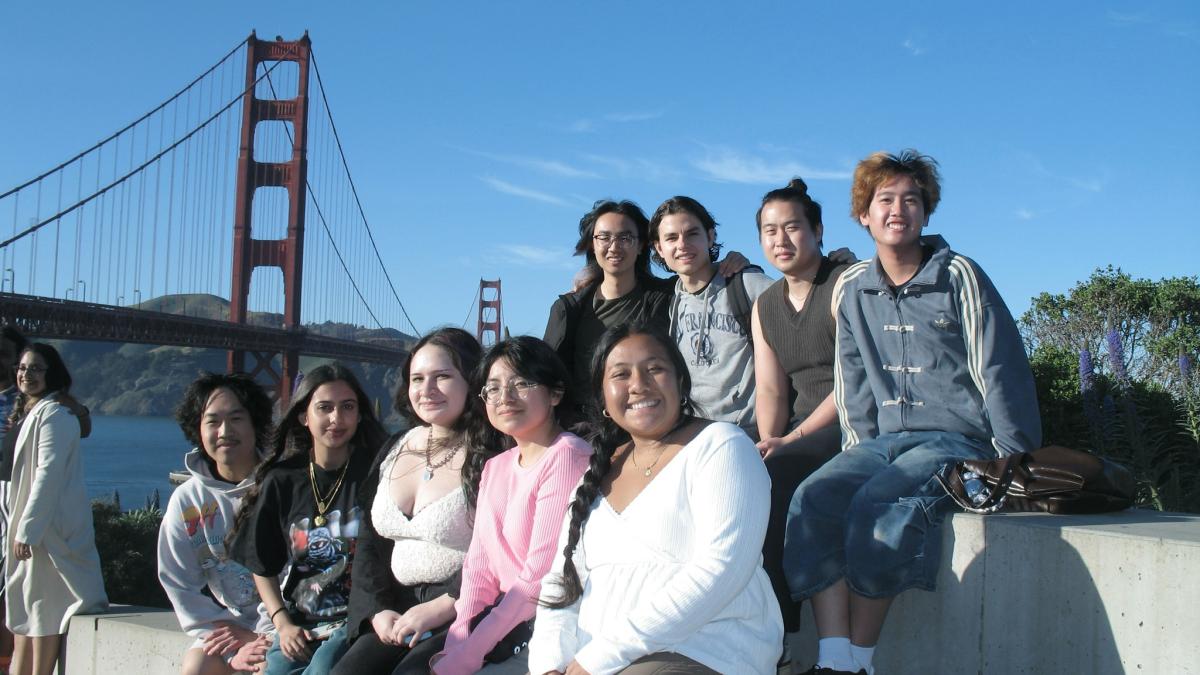 Students sit near Golden Gate Bridge