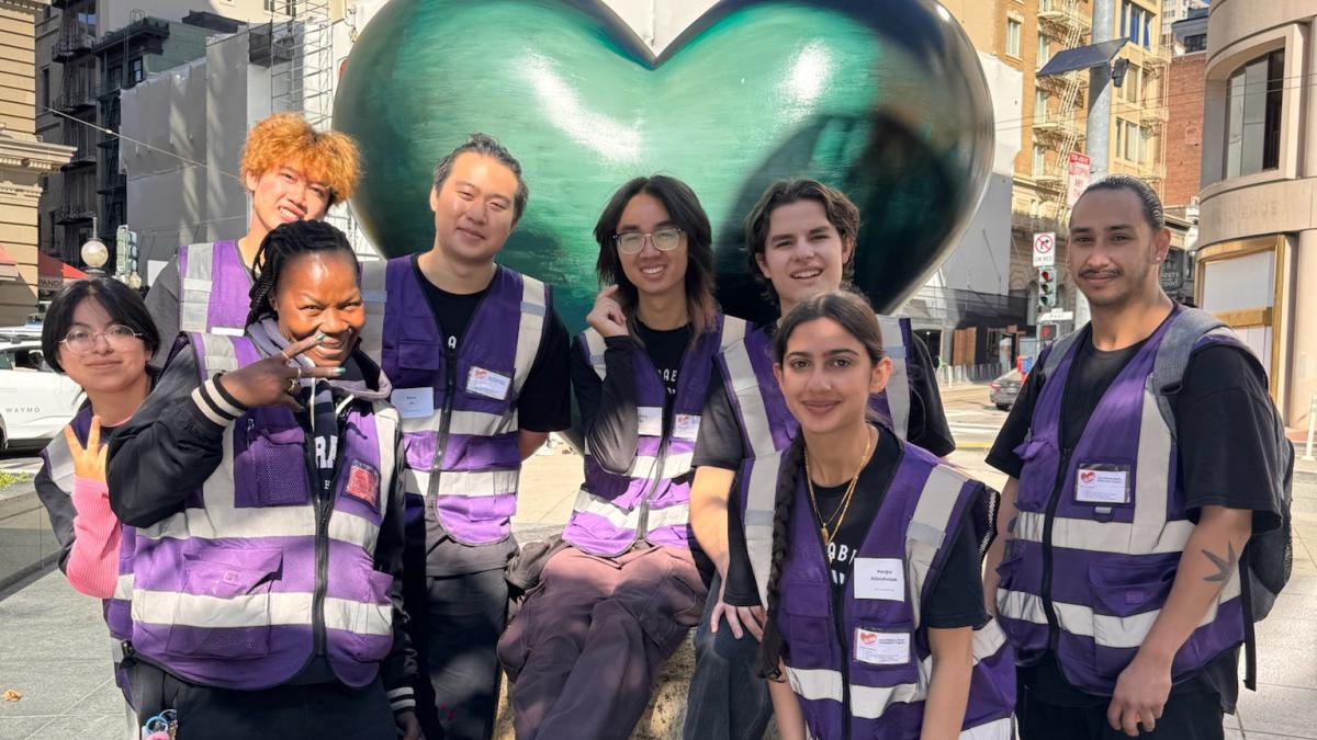 Students in front of a heart sculpture