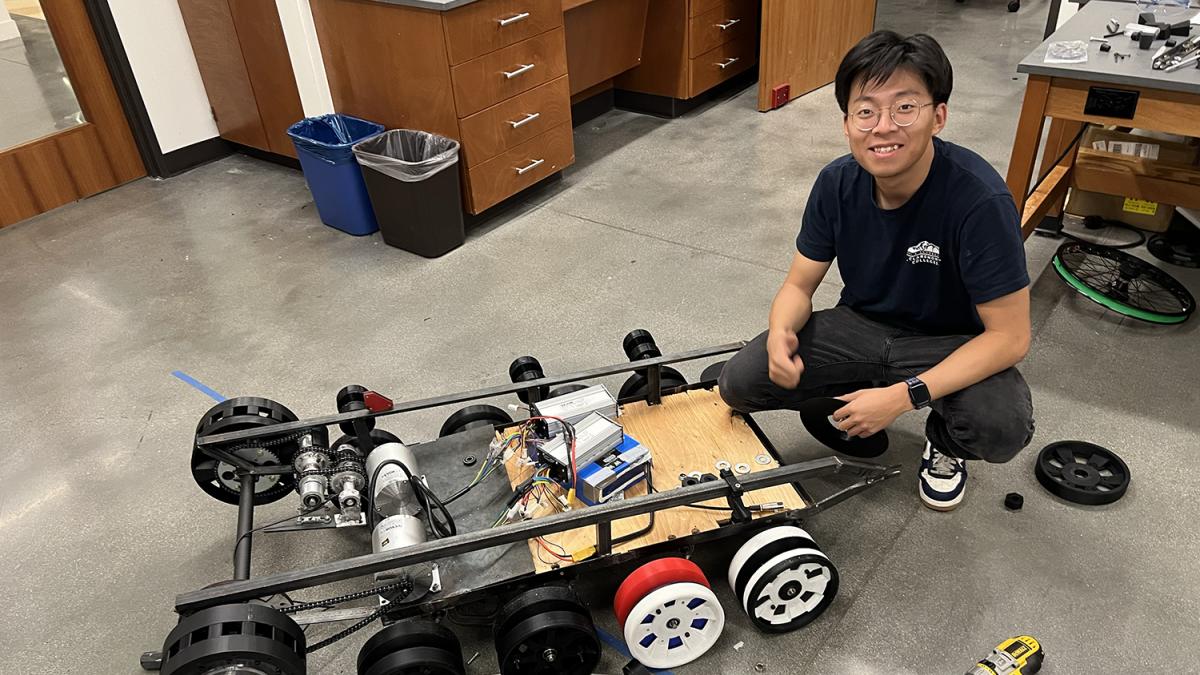 Donny Lu with a tank wheelchair