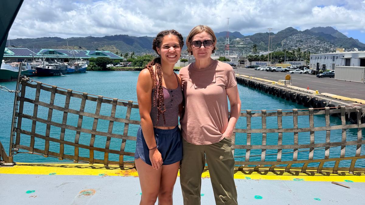 Elle Hawthorne and Masha Prokopenko on ship deck as they land in Honolulu.