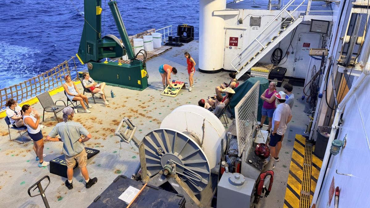 Scientists relax on the deck of the RS Kilo Moana.