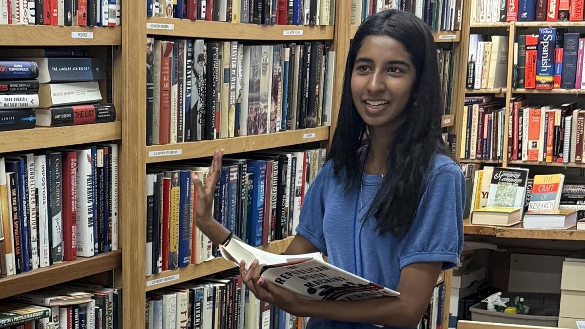 Female student with books at Pilgrim Place.