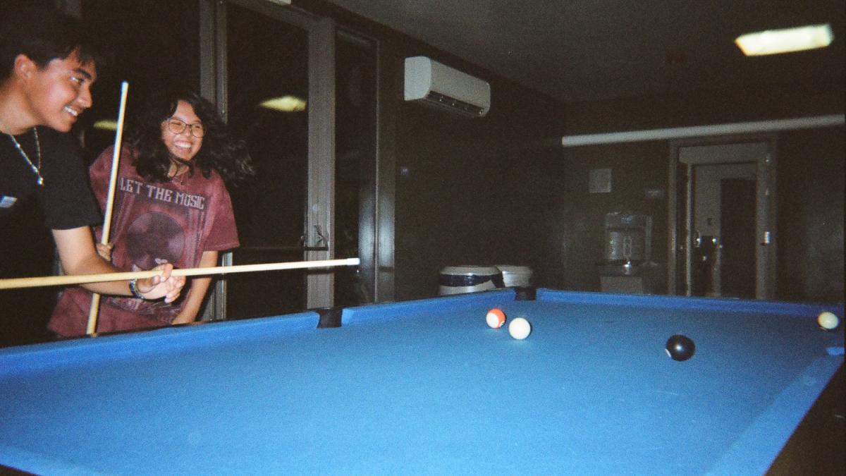 Students play pool
