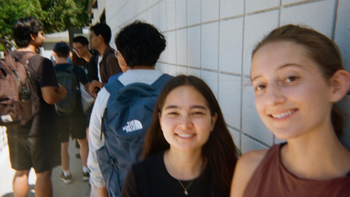 Two girls smile for a selfie