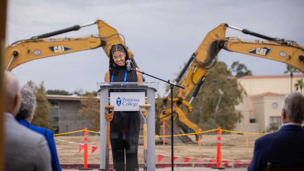 A student stands at a podium