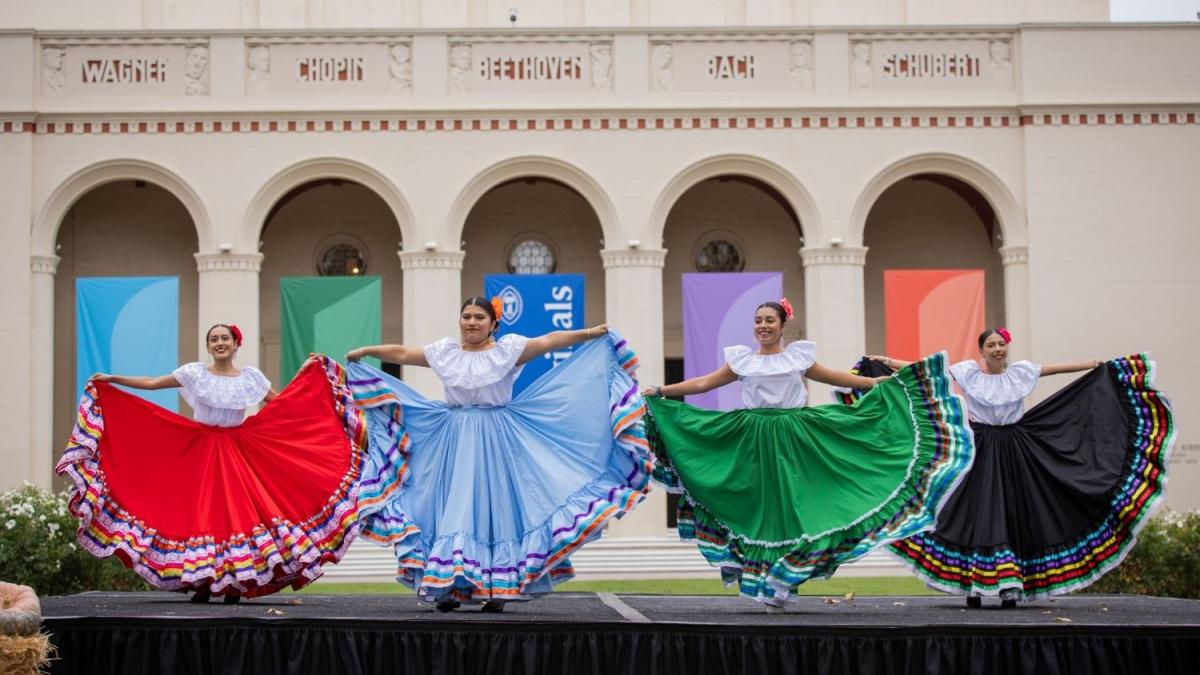 Folklórico performers in front of Bridges Auditorium