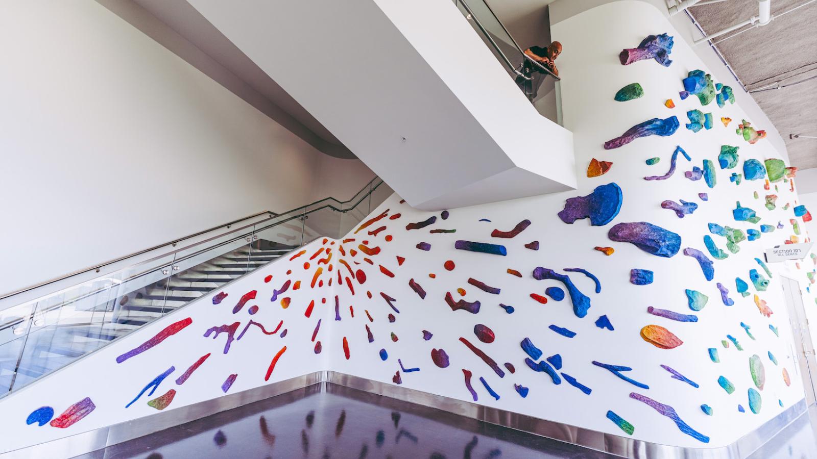 Pomona College Art Professor Sandeep Mukherjee looks down from stairway on his art installation at YouTube Theater.