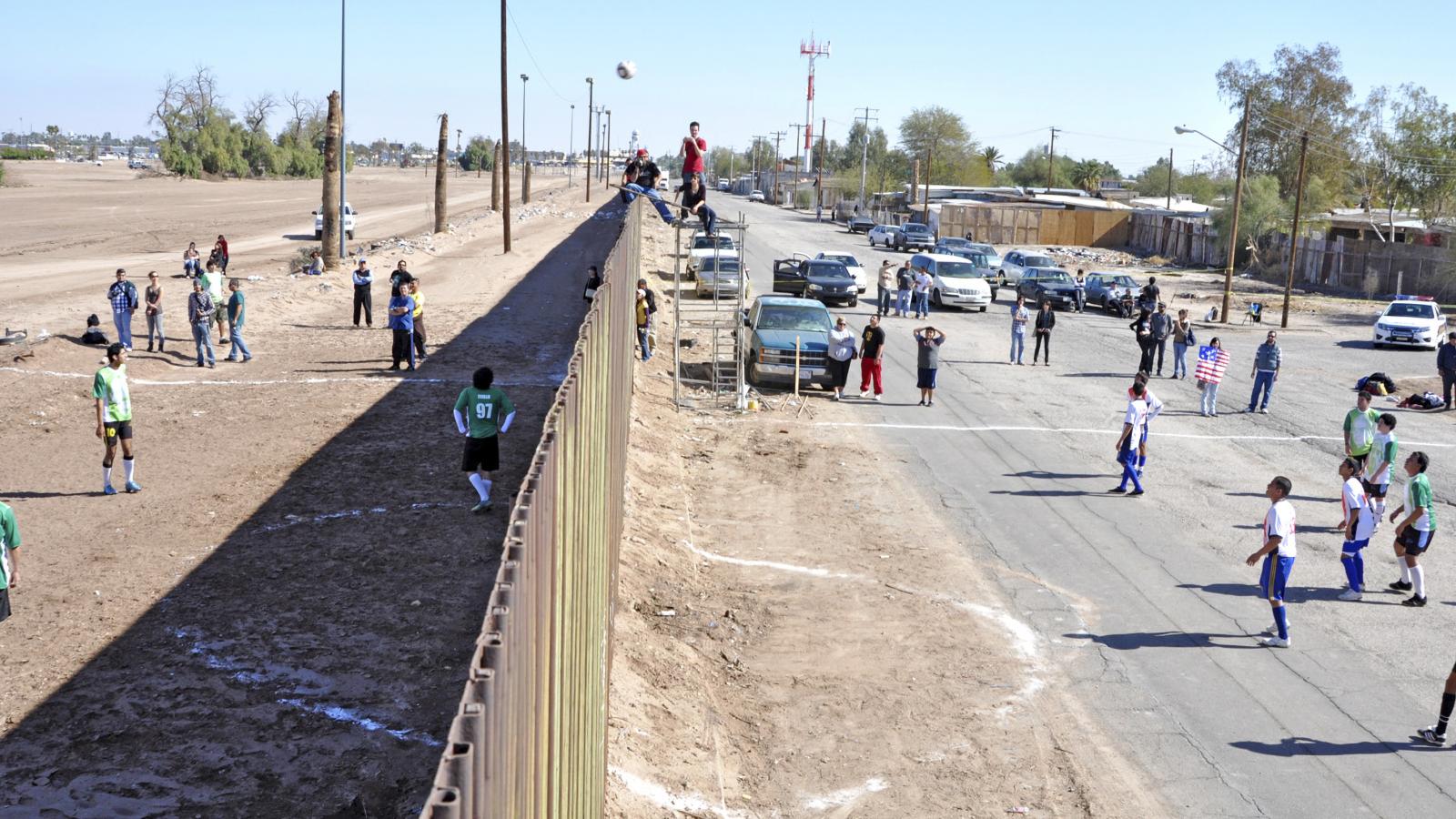 children playing soccer across the U.S.- Mexico border