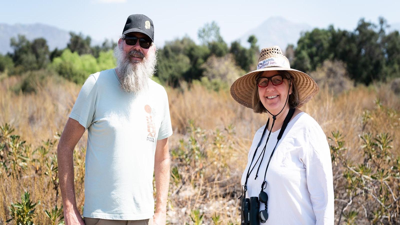 Professors Wallace "Marty" Meyer and Nina Karnovsky stand in the Bernard Field Station.