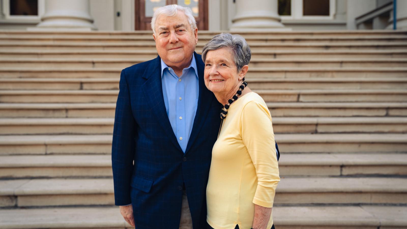 Paul and Flo Eckstein stand on the steps of Carnegie Hall at Pomona College.