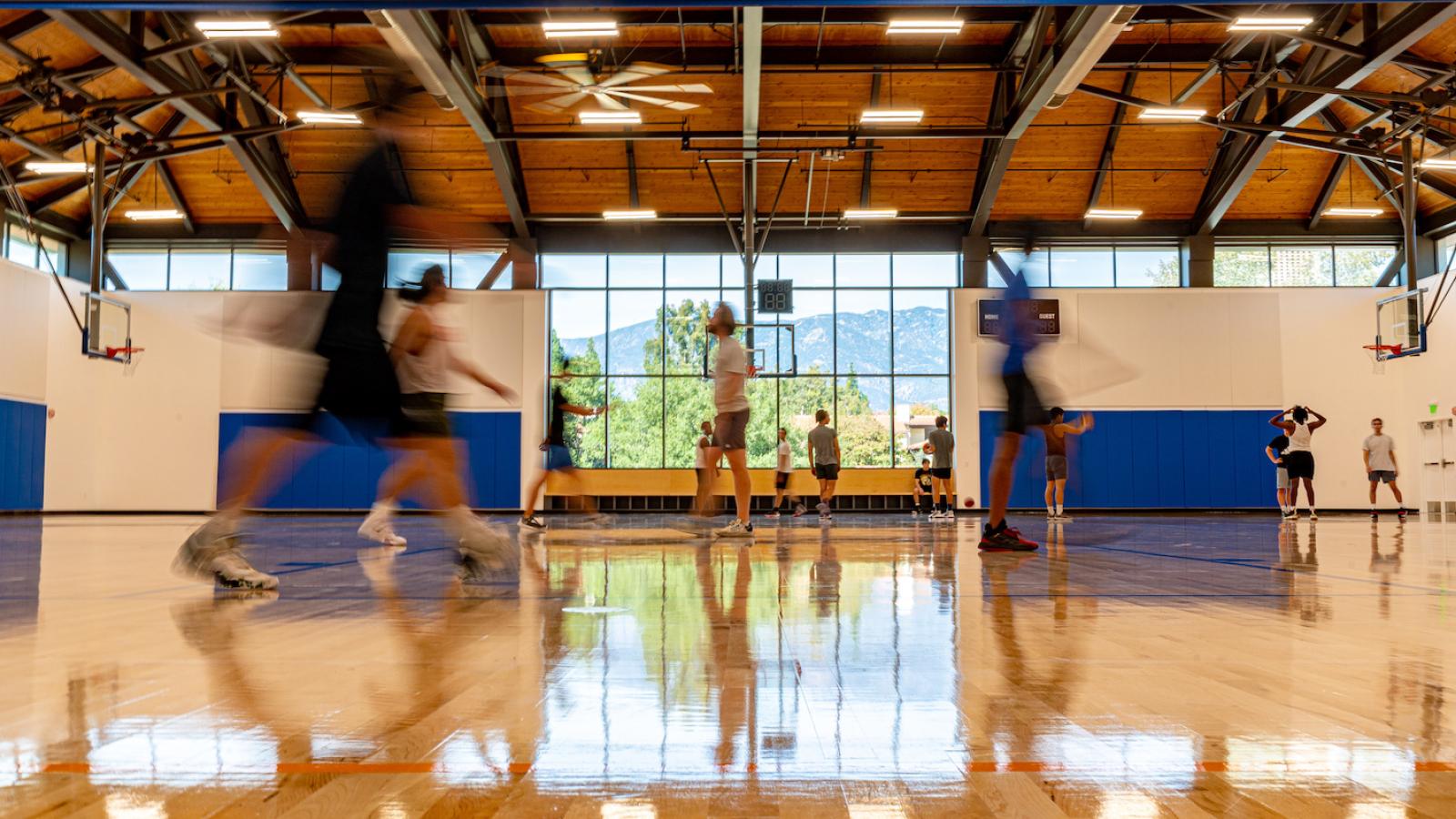 N&N Gym with view of mountains in background and players in action in foreground