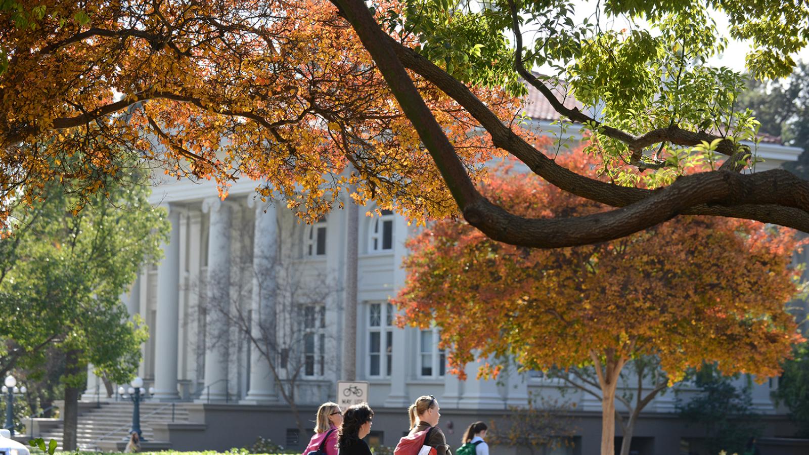 Carnegie Building with students walking in front of it