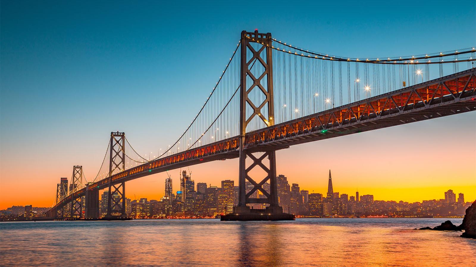 Golden Gate Bridge and San Francisco skyline at sunset