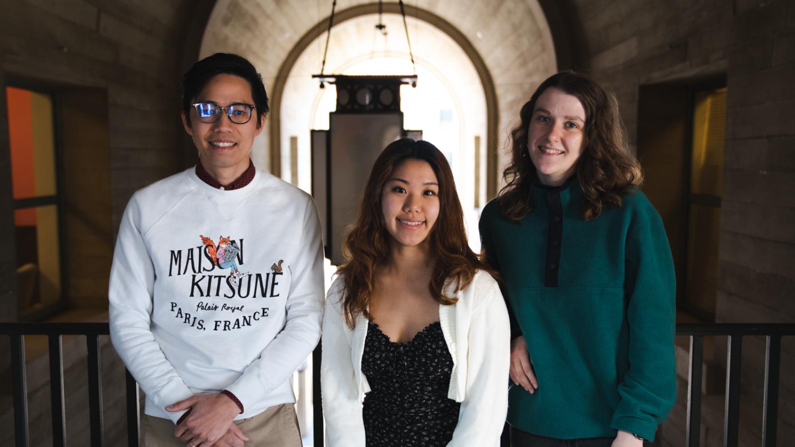 Professor Tom Le stands with students Kaylin Kim and Ava Tiller.