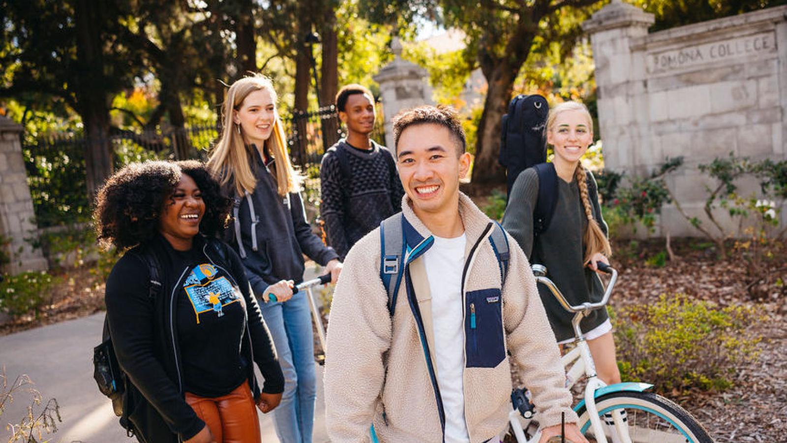 Students walking by Pomona College Gates