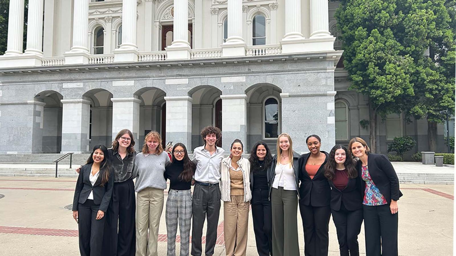 Students standing on the steps of the California Capitol building