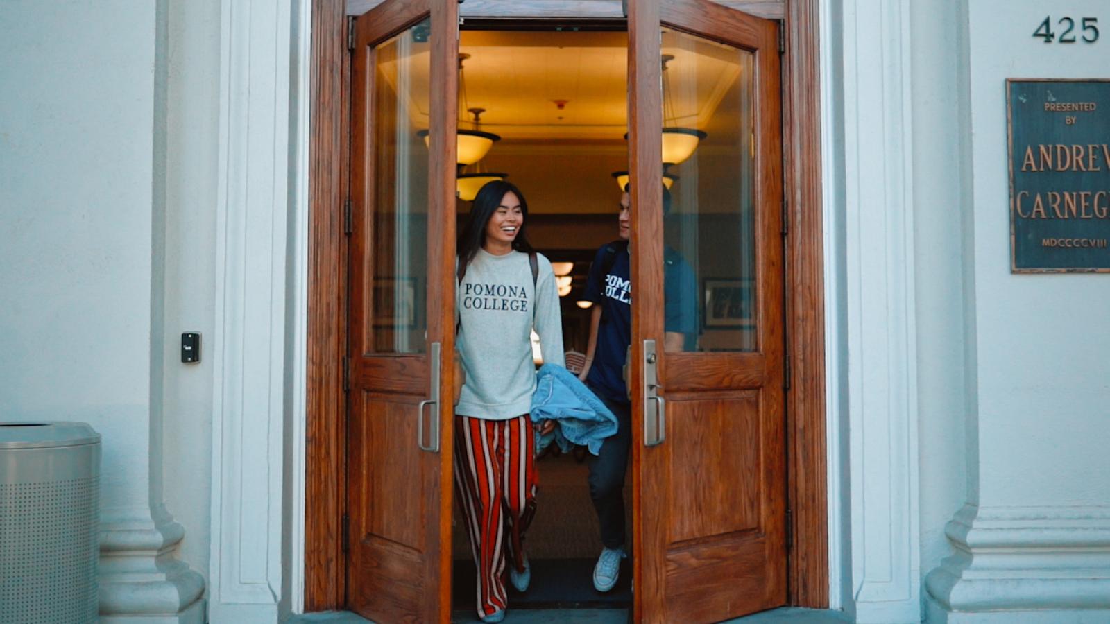 students walking through a doorway