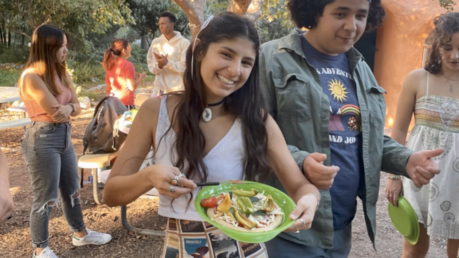 Students at a pizza-making event at The Farm