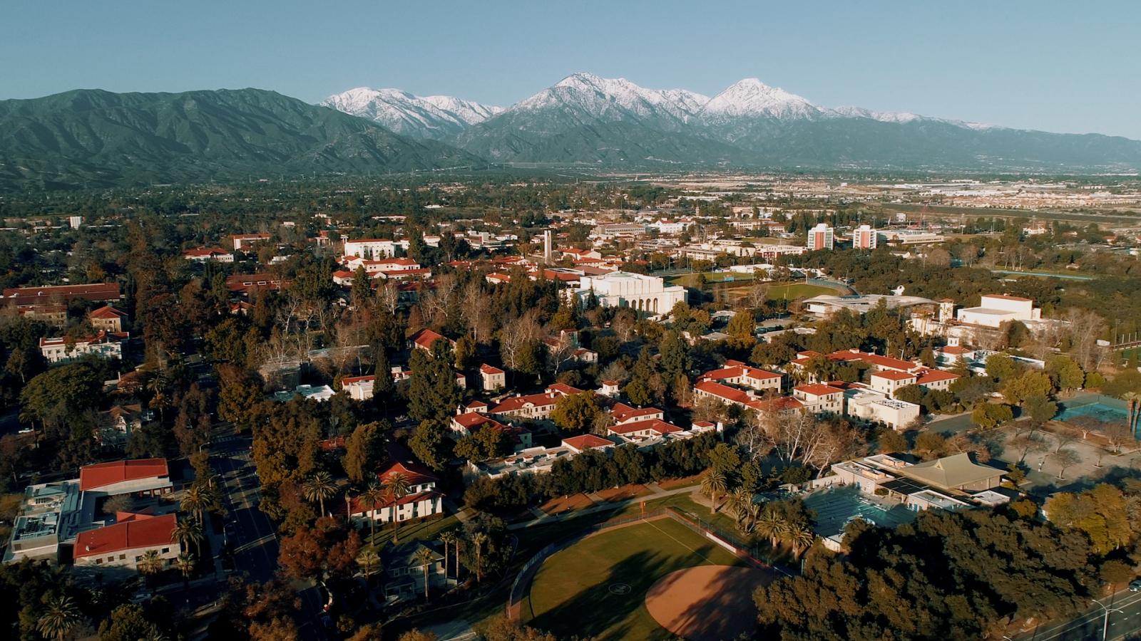 Drone shot of Pomona College with the mountains in the background