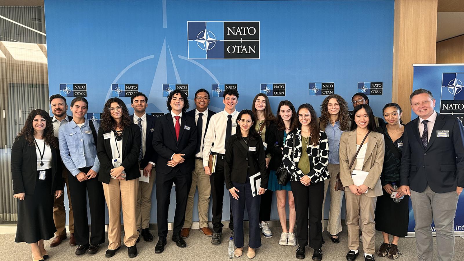 photo of students gathered in front of NATO Headquarters